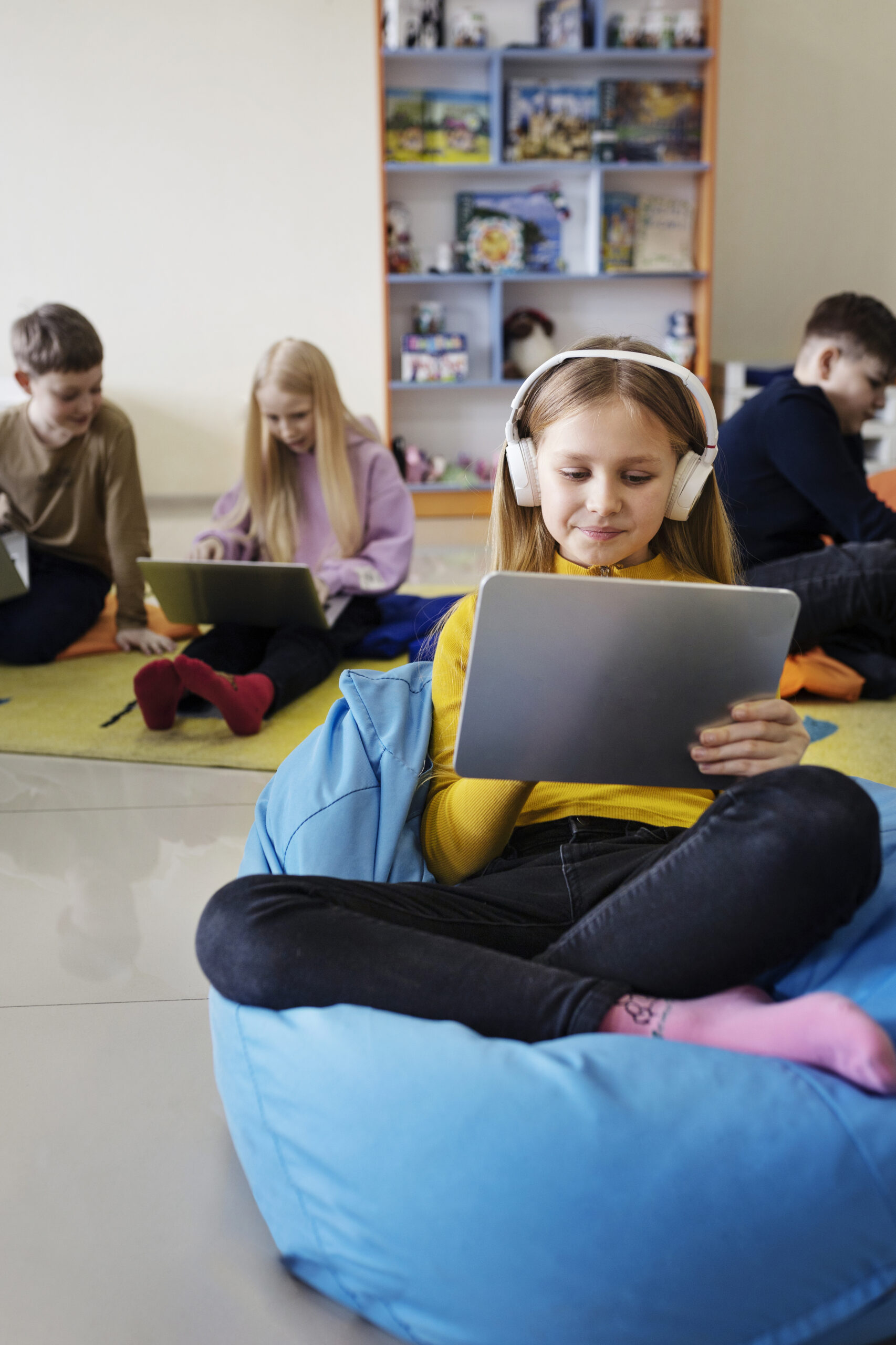 kids-using-tablet-laptop-work-listening-music